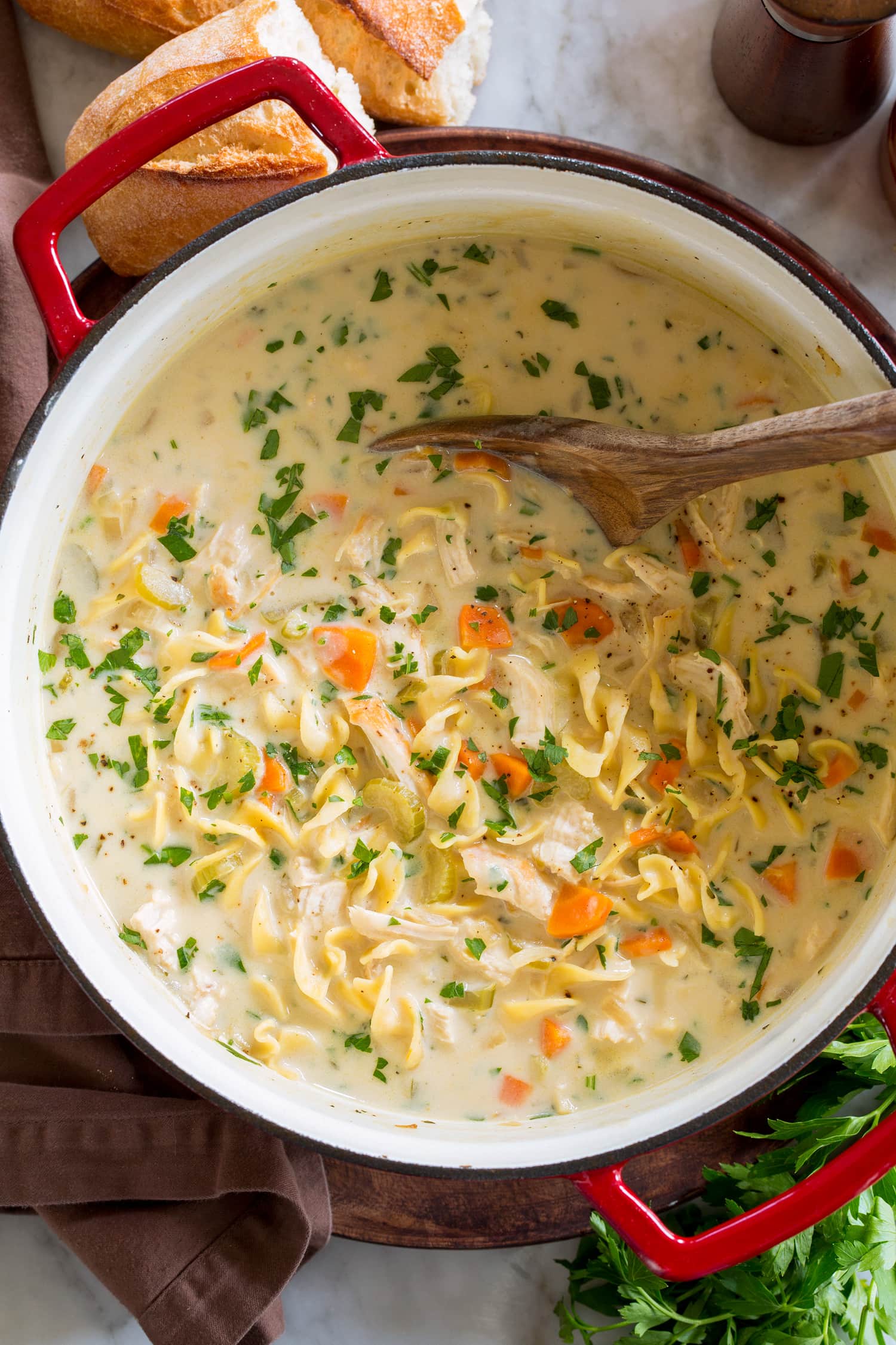 Overhead photos of chicken noodle soup with cream.