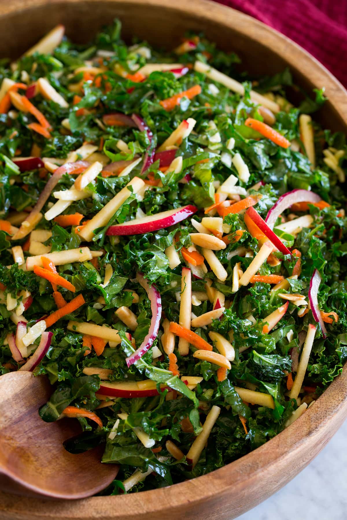 Photo: Shredded kale salad shown close up on a bowl.