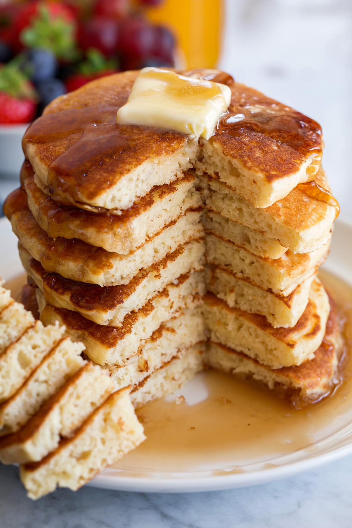 Stack of pancakes with one side cut to show interior.